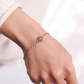 Platinum plated bracelet with silver sparkle snowflake design